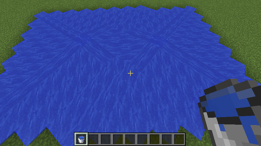 A screenshot from Minecraft showing water flowing together from two separate points